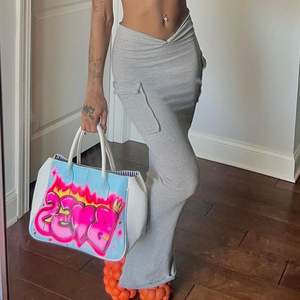 Nouvel article 2025 élégant décontracté taille <span class=keywords><strong>haute</strong></span> poche froncé couleur unie mince Sexy <span class=keywords><strong>jupe</strong></span> longue - Product Image 1