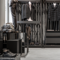 Meuble mural personnalisé pour hommes au détail Vitrine de vêtements en bois sur mesure Magasin de vêtements Design d'intérieur