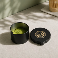 Boîte en métal ronde noire personnalisée avec bec verseur pour l'emballage et le stockage en gros de matcha, de thé vert en poudre et de grains de café