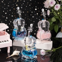 Astronaute créatif avec lanterne et violon, jouet de sable mouvant pour enfants avec dessin animé de gouttelettes d'huile flottantes, pièce de décoration de table