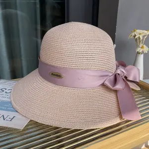 Mujer verano grandes aleros sombrilla y protector solar sombrero de paja plegable Playa Sol sombrero boda Iglesia cabeza desgaste
