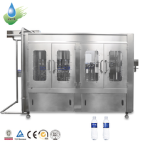 Ligne de production automatique 3 en 1 pour le remplissage, le bouchage et l'emballage de bouteilles d'eau pure minérale