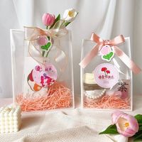 Emballage cosmétique en plastique PP avec logo personnalisé sac fourre-tout transparent réutilisable en PVC avec ruban cadeau