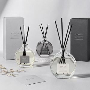 Aikun Round Clear Glass Grey Label Gift Box Reed Diffuser Set with Black Rattan Sticks Light Aroma for Bedroom Decor Display - Product Image 1