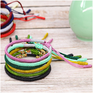 สายรัดข้อมือถักเชือกมาคราเม่ทำมือ ด้ายแดงนำโชคแบบทิเบตสำหรับผู้หญิงผู้ชาย - Product Image 5