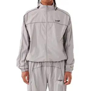 Coupe-vent en nylon avec passepoil personnalisé pour hommes survêtement de sport avec poches zippées pour le printemps