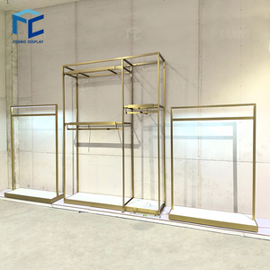 Moderno Exhibidor de Ropa de Aluminio Dorado Personalizado para Diseño de Interiores de Tiendas de Ropa y Exhibidores Ecológicos para Boutiques - Product Image 1