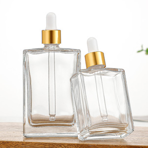 Bouteilles vides d'huile essentielle OEM contenant pour produits de soin de la peau <span class=keywords><strong>flacon</strong></span> compte-gouttes carré en verre transparent avec couvercle en bambou et pipette en caoutchouc - Product Image 1