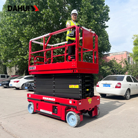 Plateforme élévatrice mobile à ciseaux avec roues en caoutchouc pour le levage de marchandises en entrepôt