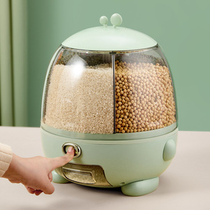 Conteneur de stockage de riz en forme d'œuf vert avec couvercle hermétique, compartiment rotatif et bouton-poussoir pour usage domestique - Product Image 1