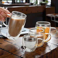 Fabrication de tasses à café en verre à haute teneur en borosilicate Tasse à café durable Tasse à jus de fruits Poignées de tasse en verre à double paroi Fabriqué en Chine
