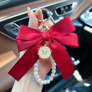 Porte-clés élégant avec nœud et perles pour femme, breloque de sac, support de clés de voiture avec pendentif, porte-clés féminin en soie - Product Image 4