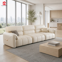 Canapé en cuir pleine fleur de style italien minimaliste, moderne et épuré, couleur crème, luxe léger, modèle Oreilles d'éléphant, pour petit appartement