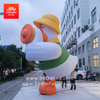 Grande mascotte de canard jaune gonflable publicitaire personnalisée pour les décorations extérieures accentuées par la lumière