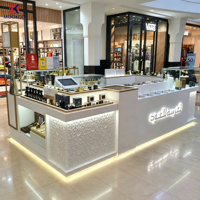 Kiosque de parfum Oud Arabe personnalisé, texture marbre, présentoir en verre avec finition dorée et logo de marque pour centre commercial