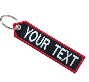 Regalos promocionales personalizado negro bordado Logo vuelo llavero etiqueta - Product Image 1