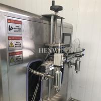 Pompe à engrenages semi-automatique à double buse Henwi avec balance intégrée, pour le remplissage de liquides visqueux et fins dans divers secteurs