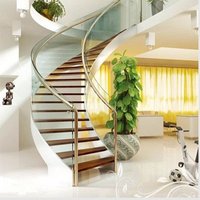 Escalier incurvé CBMmart avec main courante en bois de luxe et marches en marbre et quartz