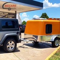 Remorque de camping compacte Wecare avec tente de toit, réservoirs d'eau potable de 80L et d'eaux usées de 80L, et porte-moto