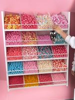 Présentoir design moderne personnalisé pour magasin de sucettes et de bonbons Éclairage LED populaire Décoration d'aliments sucrés Vitrine à vendre