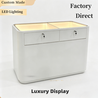 Vitrine à bijoux de luxe moderne avec éclairage LED, design étanche, construction durable, finition polie, étagère arrière solide, personnalisable