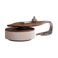 Table basse moderne minimaliste en bois massif de forme irrégulière en forme de feuille avec espace de rangement et plateau en cuir pleine fleur, mobilier de maison