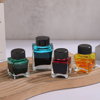 Bouteilles en verre d'encre transparente de forme carrée personnalisée de haute qualité 15ml 25ml 30ml 50ml avec couvercle à vis phénolique