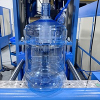 Machine de soufflage de bouteilles PET semi-automatique à cavité unique 10L 20L pour la fabrication de grandes bouteilles d'eau, machine de moulage par soufflage de plastique