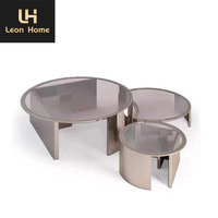 Table basse de luxe minimaliste en verre transparent ronde et moderne pieds en acier inoxydable