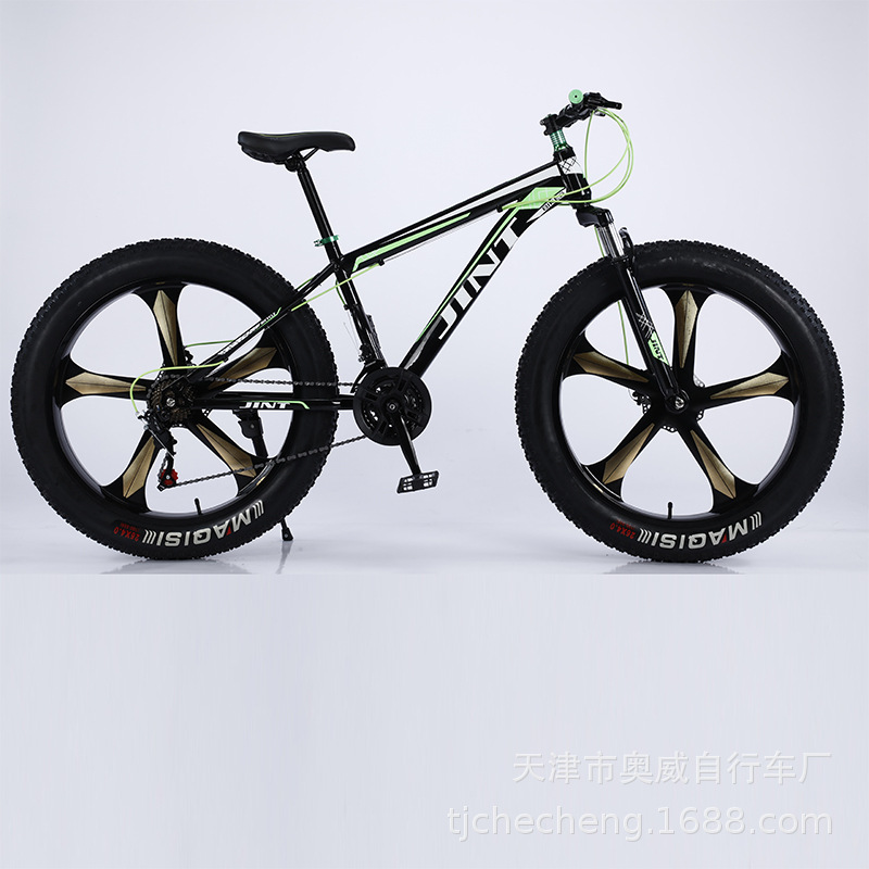 Moto de nieve verde de 5 palas, 26 pulgadas y 24 velocidades.