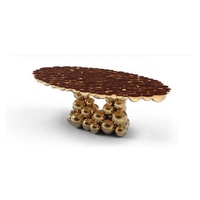 Table de salle à manger moderne de luxe en acier inoxydable plaqué or avec dessus ovale en fonte laquée pour la maison et les meubles d'hôtel