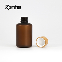 Botol Plastik Silinder PET Amber Frosted Berkualitas Tinggi 250ml Dengan Tutup Bambu Untuk Krim Wajah, Masker, Sampo, Losion, Penggunaan Kosmetik
