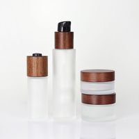 Ventas calientes Ash Tree Tapa de aerosol de madera Tapa de bambú Botellas de bomba de vidrio cosmético para cosméticos