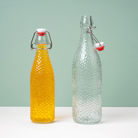 Bouteille en verre réutilisable à bouchon basculant pour la fermentation artisanale de lait, de soda, du thé et des jus, avec couvercle hermétique