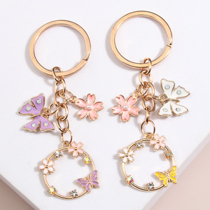 Lindo esmalte mariposa Sakura flor llavero hecho a mano aleación Zinc DIY joyería para mujeres niñas jardín llaveros amistad regalos - Product Image 1