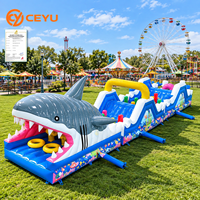 Toboggan aquatique gonflable Ceyu avec entrée en forme de bouche de requin, imprimé animaux marins, arche ondulée et zone de saut pour la location de fêtes pour enfants