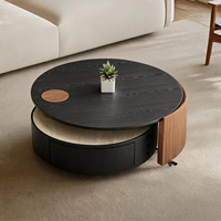 Table basse ronde moderne avec plateau en pierre frittée travertin, tiroir unique et rotation à 360° °   Plateau rotatif en placage de bois noir