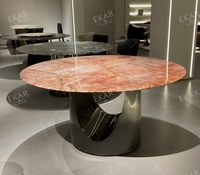 Table à manger ronde moderne, surface aspect pierre foncée, piédestal sculptural en U pour salle à manger