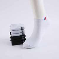 Vente en gros Chaussettes en coton blanc noir Chaussettes de cheville respirantes et absorbant la sueur personnalisées pour femmes et hommes