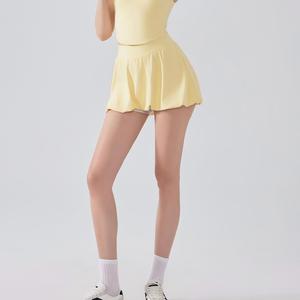 Jupe de tennis taille haute pour femme avec ourlet bouffant, short intégré et poches latérales, séchage rapide, anti-transparence, idéale pour l'entraînement (vente en gros) - Product Image 4