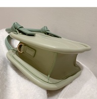 Jeune fille Style décontracté une épaule Biscuit fermeture à glissière en cuir PU doublé sac à main avec Logo personnalisé dames sac de messager