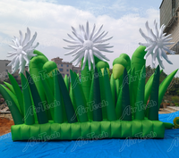Ballon publicitaire gonflable vert avec ventilateur intégré et résistant au soleil pour la décoration d'événements en extérieur