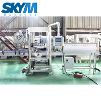 Machine d'étiquetage automatique à manchon rétractable SKYM pour bouteilles d'eau minérale et de boissons