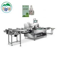 Système de mise en carton en ligne pour le chargement de flacons de répulsif anti-moustiques électriques et la sortie en carton