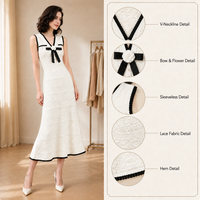 Robe longue en maille chic française d'été 2026, col en V, blanche, sans manches, ajourée, avec nœud, élégante, coupe trapèze pour femme
