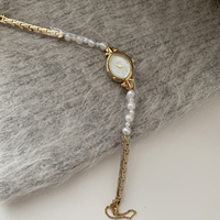 Montre française à petit cadran elliptique avec chaîne en perles naturelles, montre d'affaires, montre tendance pour femmes