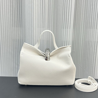 Sac à bandoulière pour femme au design de niche, en cuir de vachette de qualité supérieure, motif uni, forme oreiller, boucle métallique, léger