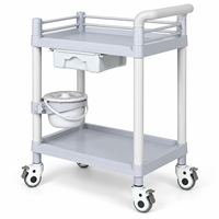 Chariot médical ABS à deux niveaux pour salle d'opération avec un seul tiroir et des barrières de sécurité pour la manipulation des instruments et le soutien clinique