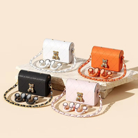 Écouteurs Bluetooth TWS élégants à clip d'oreille avec réduction de bruit ENC et étui de chargement de type sac pour femmes