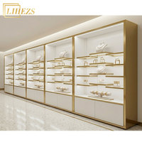 Muebles Modernos para Joyería de MDF Dorado con Vidrio Templado, Exhibidores de Pared para Joyería